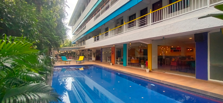 A goSTOPS hostel with its pool and social spaces